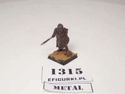 Zdradliwa i ponętna kobieta z włócznią i gołą łydką. Metal 1315