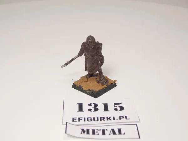 Zdradliwa i ponętna kobieta z włócznią i gołą łydką. Metal 1315
